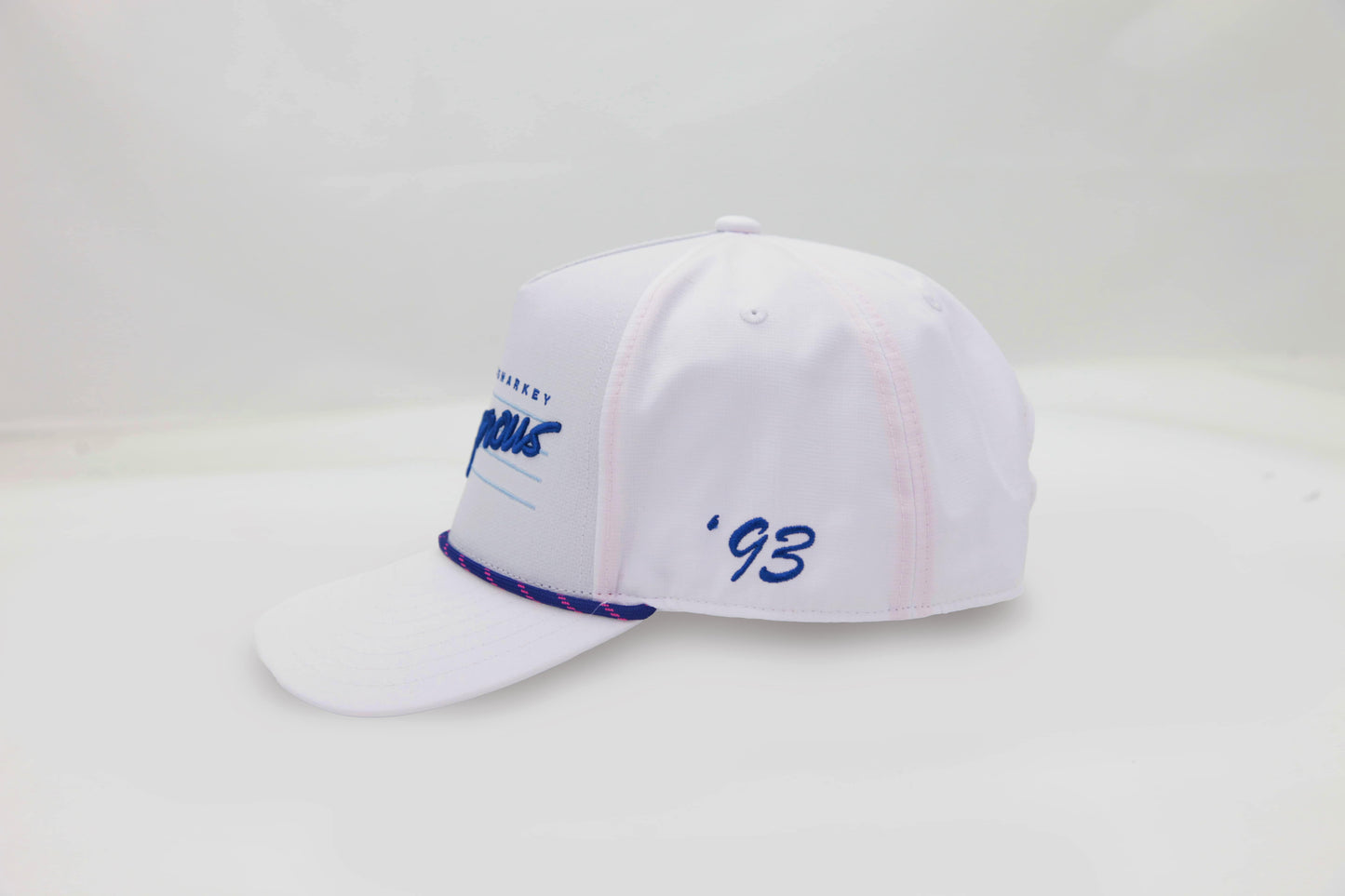 Side view of The Ice Dangerous ’93 Hat – clean white cap with blue ‘93 embroidery and bright blue and pink rope accent along brim.