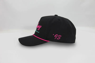 Black embroidered baseball cap with 'Sharkey Swim' text on front, pink rope detail on brim, and '93 on side panel