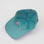Underbrim view of The Sharkey Cruiser Hat – teal interior lined with tropical blue, teal and pink Maxwell Sharkey taping.