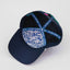 Underbrim view of The Midnight Cruiser ’93 Hat – navy interior with blue and white signature Maxwell Sharkey pattern. The hat is lined with a funky teal and blue taping displaying Maxwell Sharkey in a chunky, fun font.
