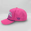 Side view of The Sunset Slasher ’93 Hat – hot pink cap with side ‘93 embroidery in blue.