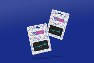 Flat lay of two Maxwell Sharkey digital gift cards on a blue background – available in multiple amounts. 